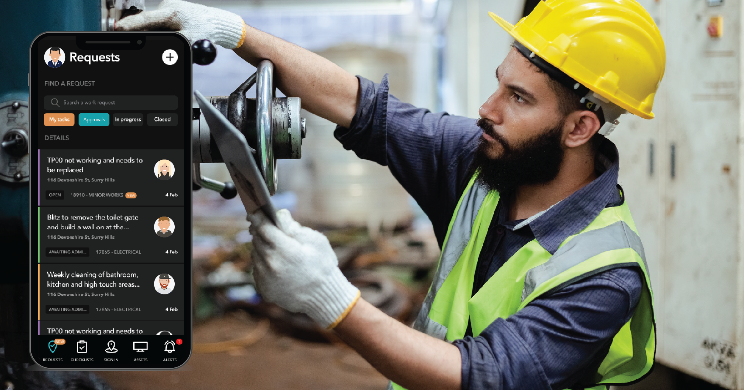 man working with ipad on site